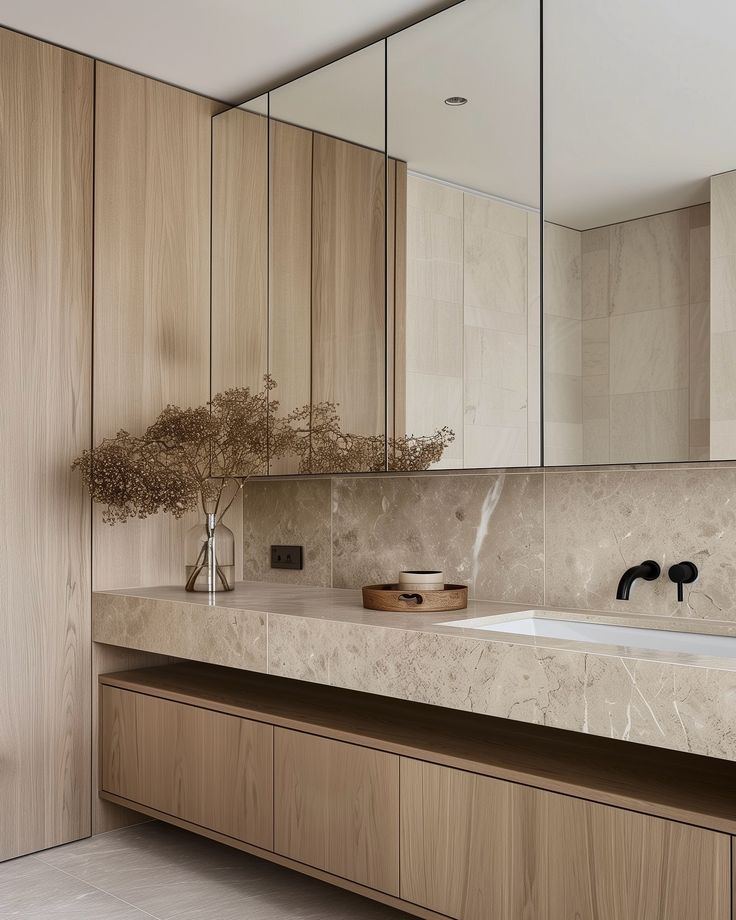 Wall-to-wall vanity with a sleek stone benchtop and integrated cabinetry