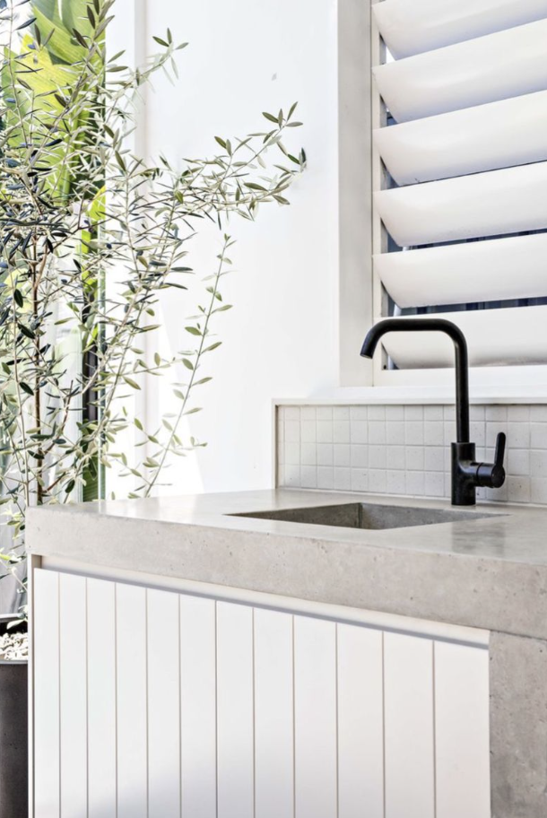 Grey stone alfresco benchtop with VJ panelled cabinet doors for a classic finish